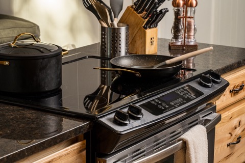 Stovetop with cookware ready in the kitchen.