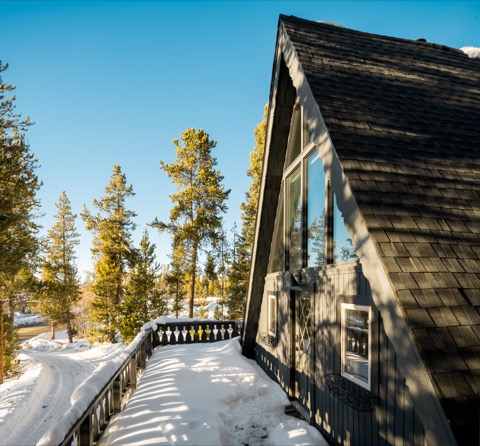 The A-frame's facade in golden afternoon light.