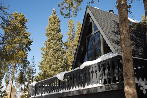 The A-frame's peak against a bright blue sky.